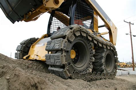 skid steer tire chains vs tracks in mud|john deere tracks vs tires.